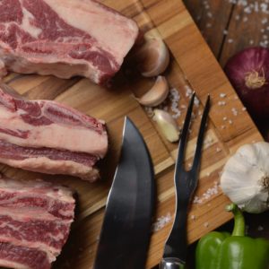 sliced raw meat on chopping board