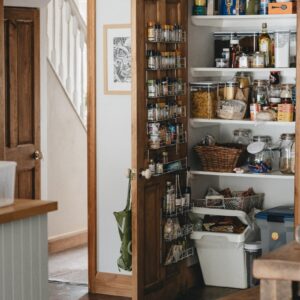 brown wooden shelf with bottles
