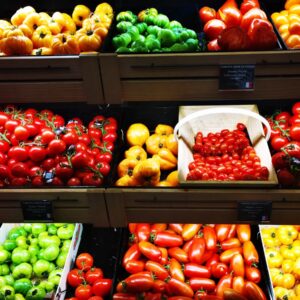 assorted fruits on display in shelves